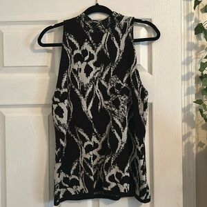 White House Black Market sleeveless mock neck. Black and white